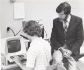 Gilmore and student at computer
